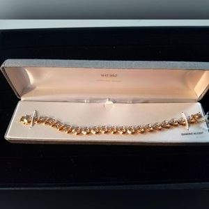Gold over silver heart bracelet with diamonds
